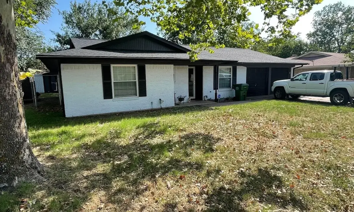 Professional roofing crew working on a residential roof in Tupper Lake